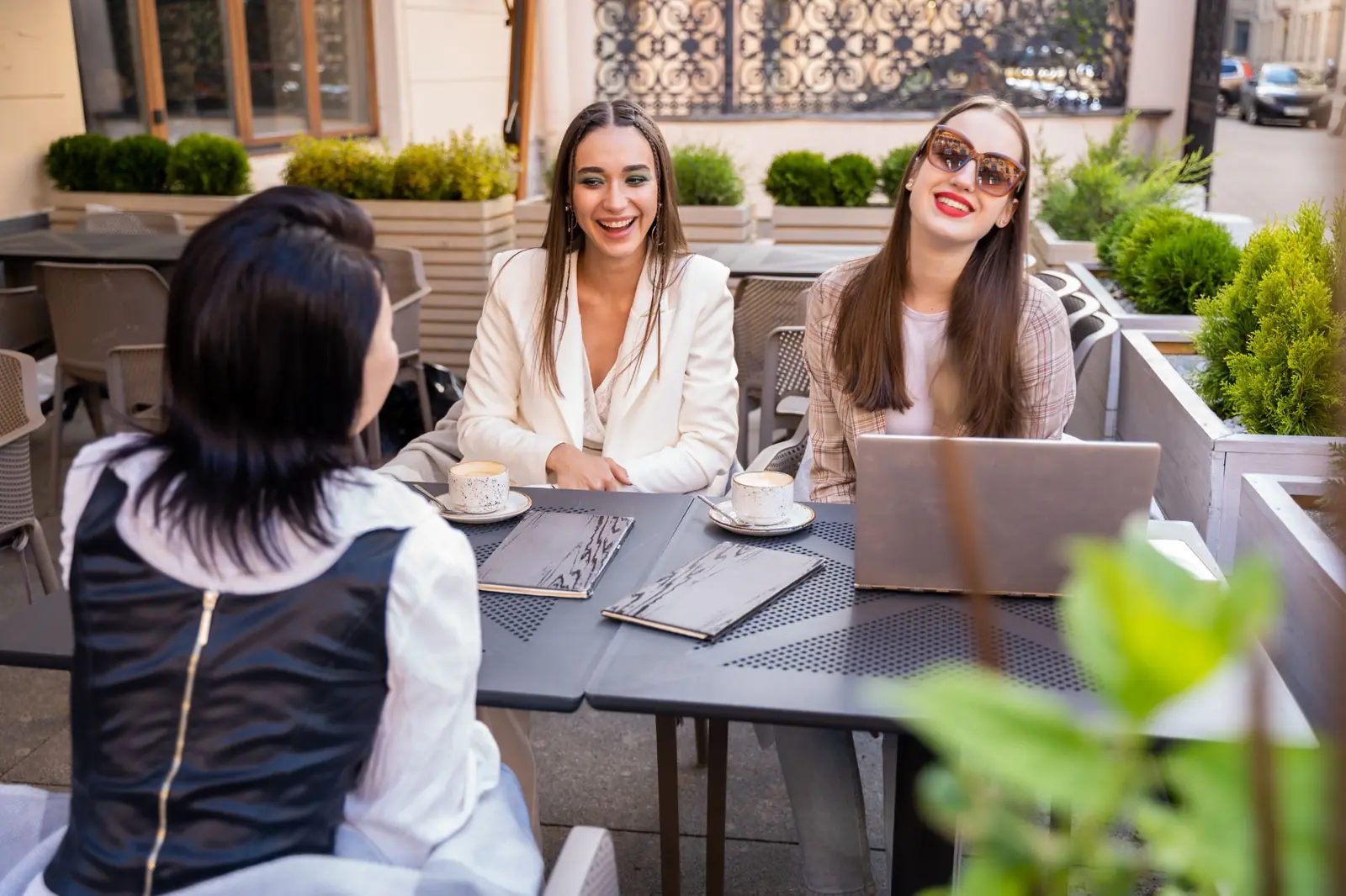 Travellers planning together at an outdoor café